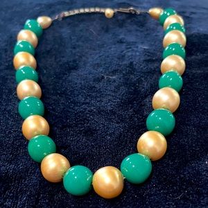 Vintage Women’s Green and Gold ball necklace with crystal stones on clasp.